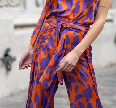 Pantalones naranja/violeta de animales